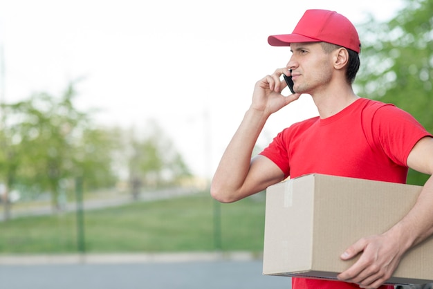 Delivery guy holding box