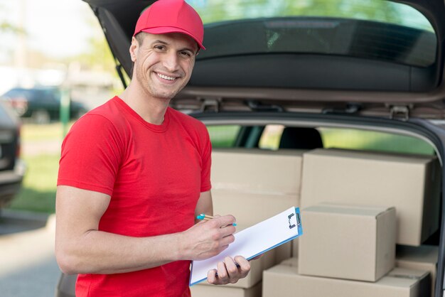 Delivery guy holding clipboard