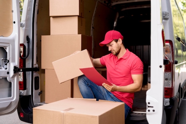 delivery male with package list