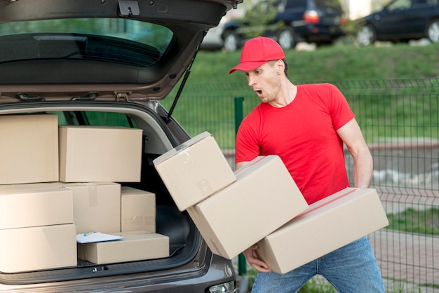 Delivery man dropping boxes