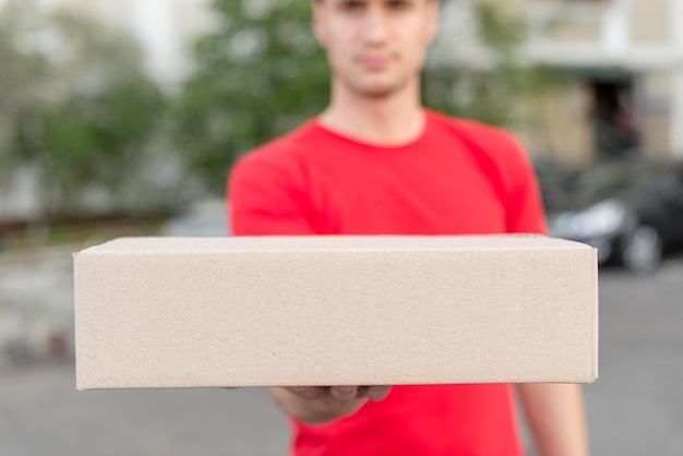 Delivery man holding box