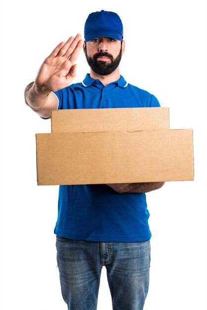 Delivery man making stop sign