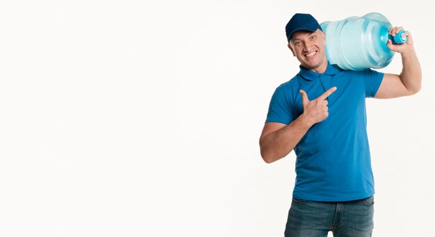 Delivery man pointing at water bottle on shoulder