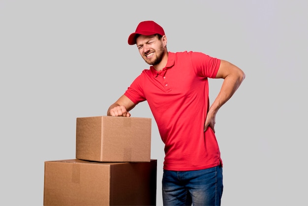 Free photo delivery man tired from carrying