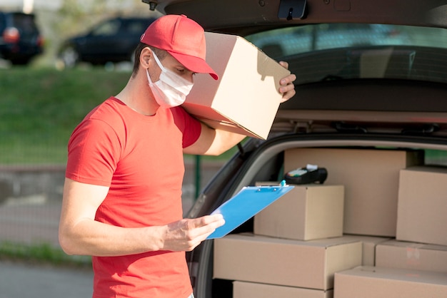 delivery man wearing mask and hat