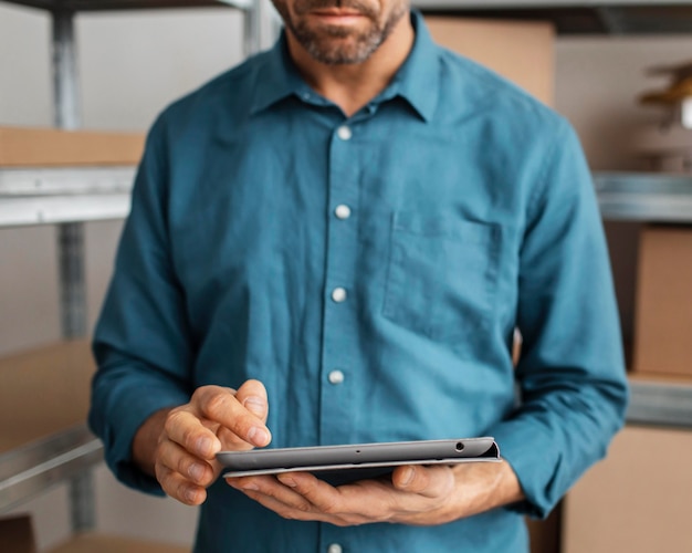 Delivery man with clipboard close up