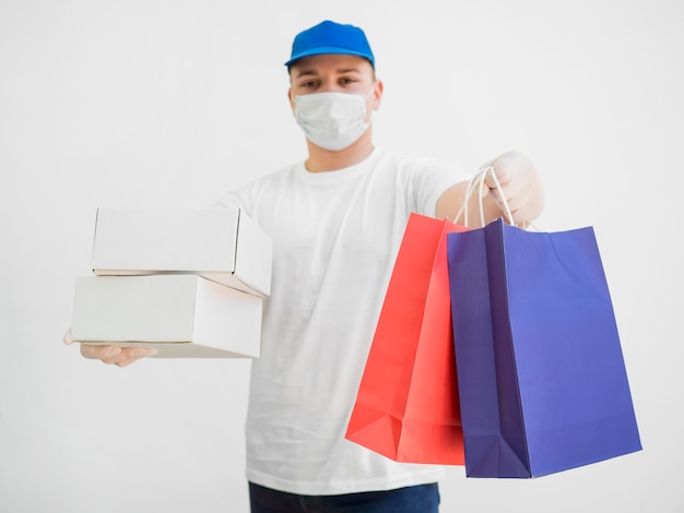 Delivery man with mask and bags