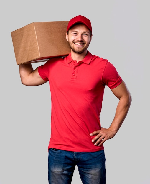 Delivery man with package on shoulder