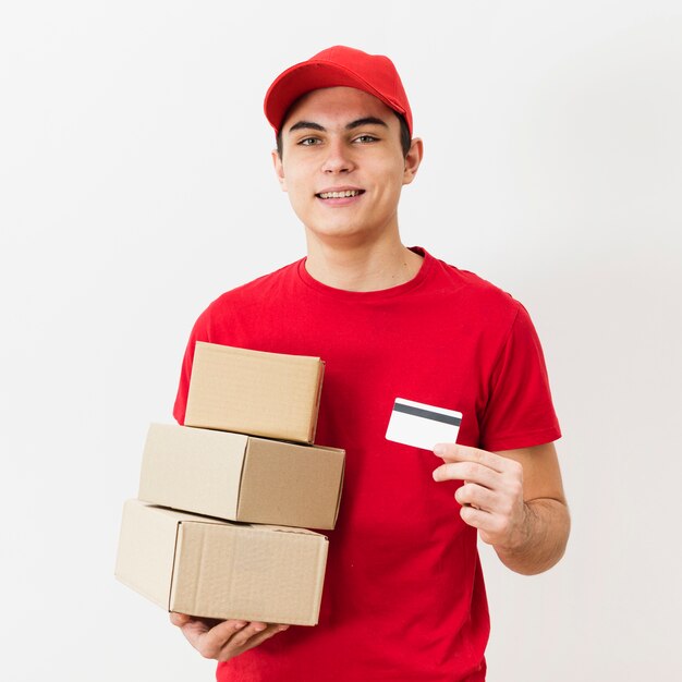 Delivery man with packages and credit card