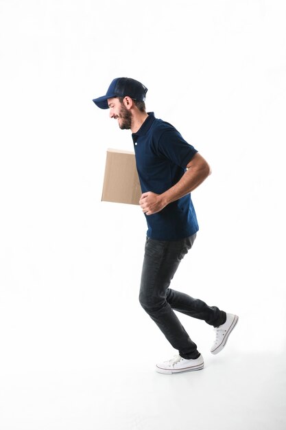 Delivery man with parcel running on white background