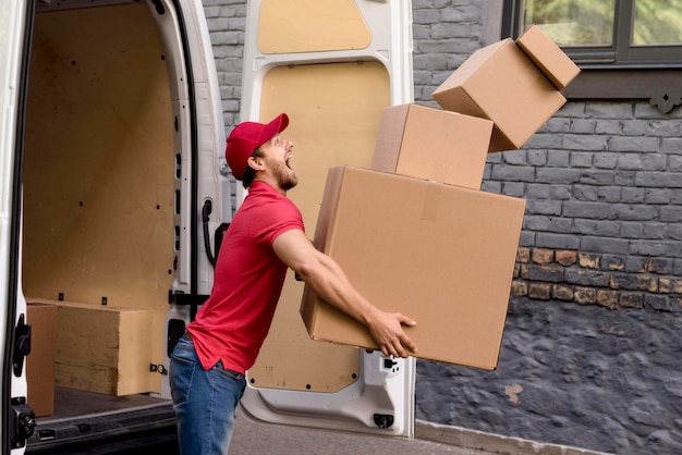 Delivery man with stack of packages