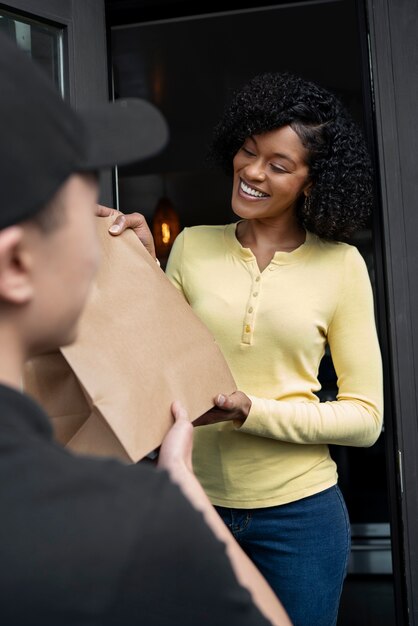 Delivery person getting parcel out for delivery