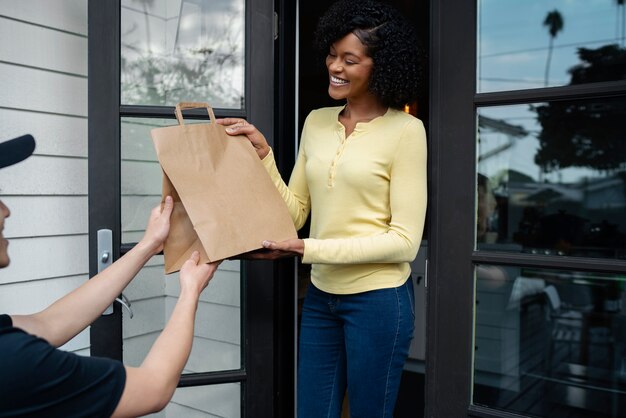 Delivery person getting parcel out for delivery