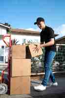 Free photo delivery person getting parcel out for delivery