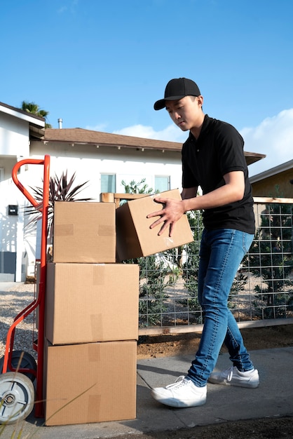 Delivery person getting parcel out for delivery