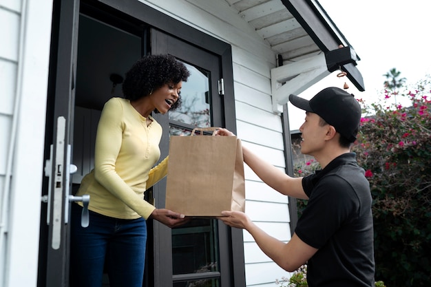 Delivery person getting parcel out for delivery