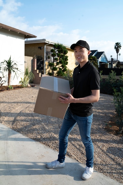 Delivery person getting parcel out for delivery