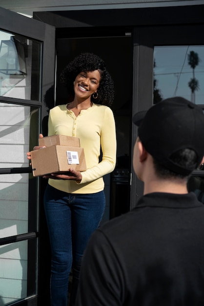 Delivery person getting parcel out for delivery