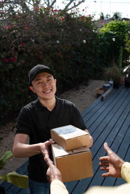 Delivery person getting parcel out for delivery