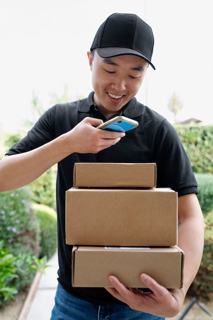 Delivery person getting parcel out for delivery