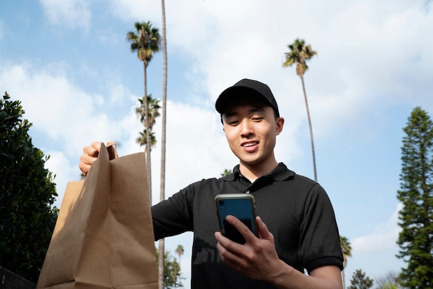 Free photo delivery person getting parcel out for delivery