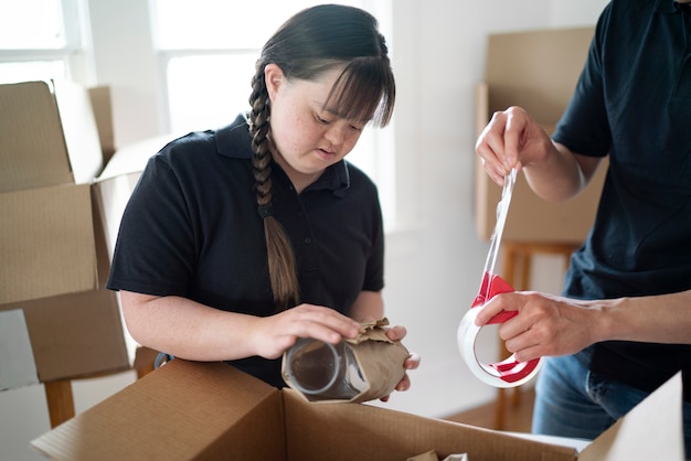 Delivery person getting parcel ready for delivery