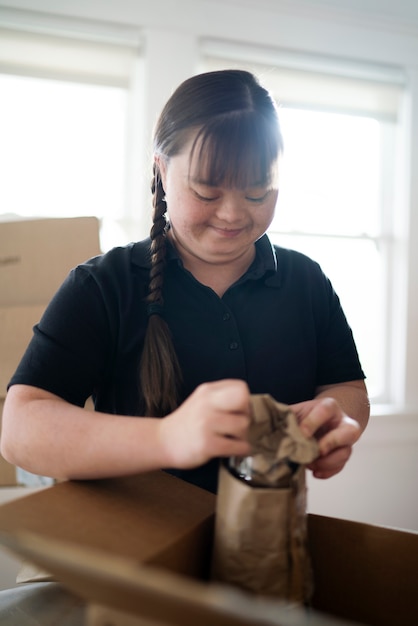 Delivery person getting parcel ready for delivery