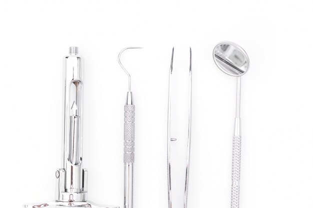 Dental tools and equipment on white background