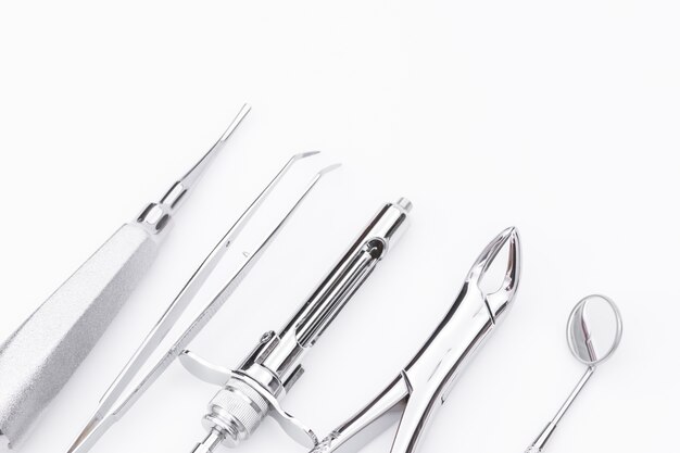 Dental tools and equipment on white background