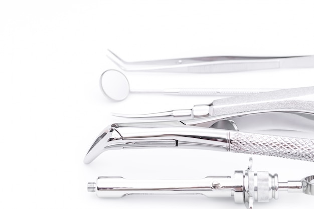 Dental tools and equipment on white background