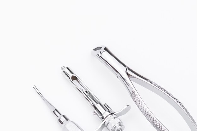 Dental tools and equipment on white background