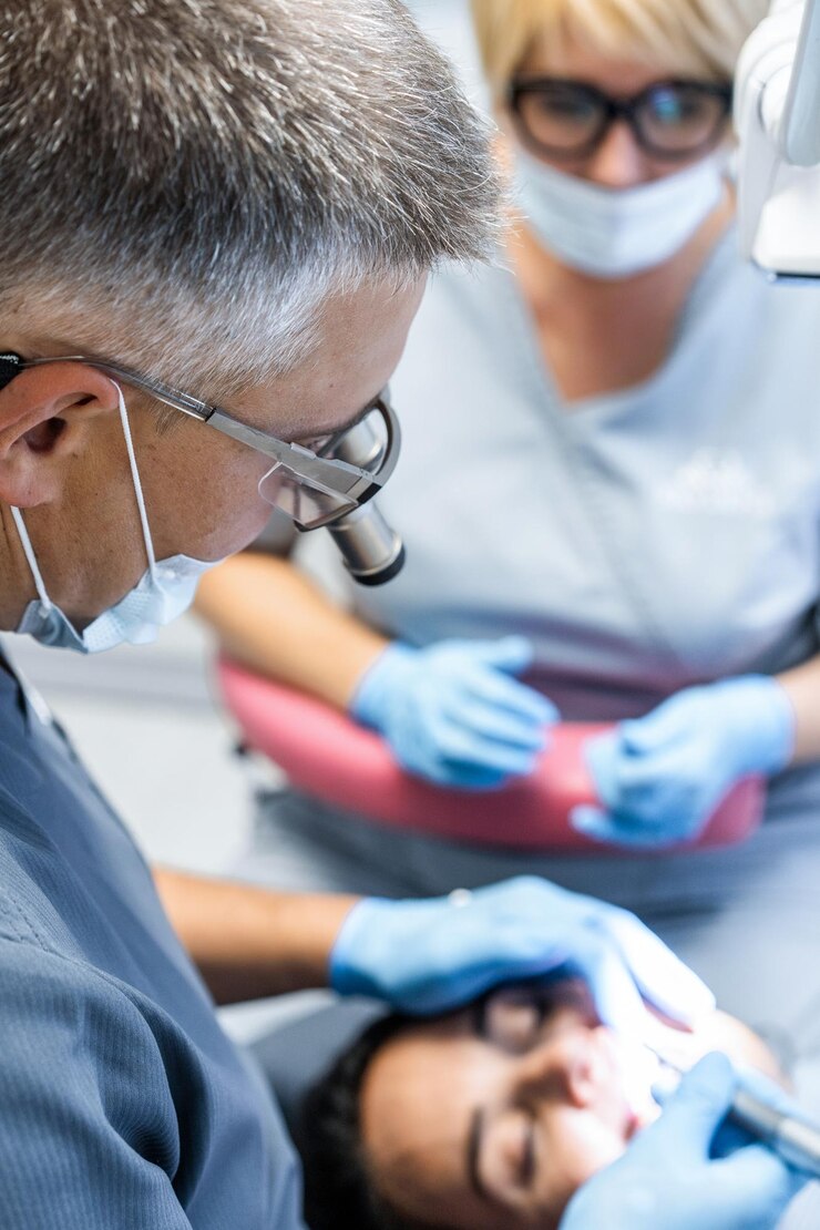 Free Photo dentist in the process. dental services, dental office, dental treatment.