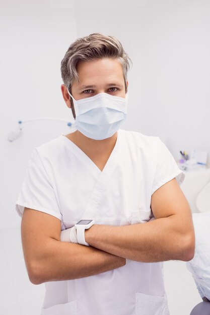 Dentist standing with his arms crossed