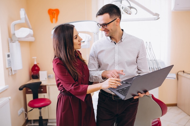 Dentist with patient at a visit