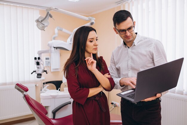 Dentist with patient at a visit