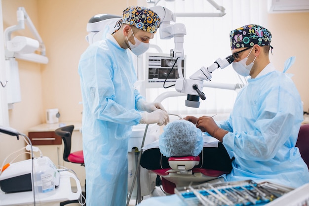 Dentist with patient at a visit