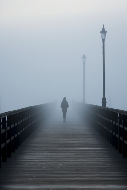 Depressed person walking alone