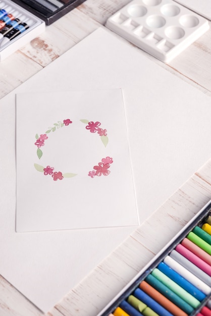 Design of flowers frame painted with watercolors on paper