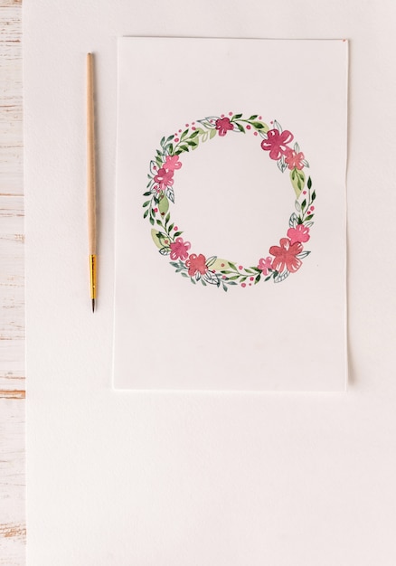 Design of flowers frame painted with watercolors on paper