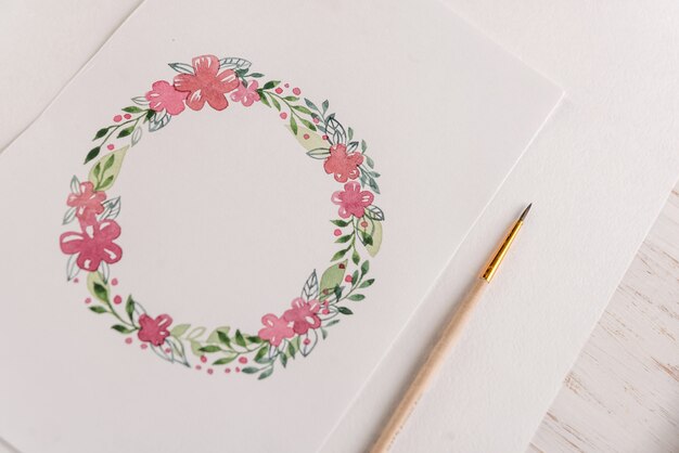 Design of flowers frame painted with watercolors on paper