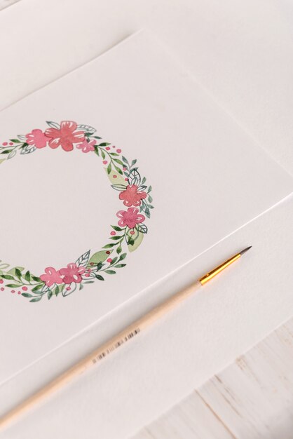 Design of flowers frame painted with watercolors on paper