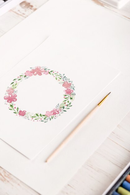 Design of flowers frame painted with watercolors on paper