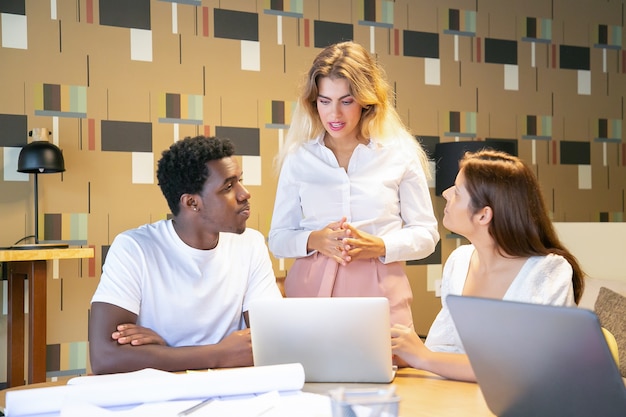 Designers showing project presentation to leader