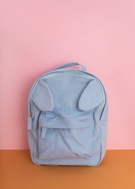 Desk arrangement with blue backpack