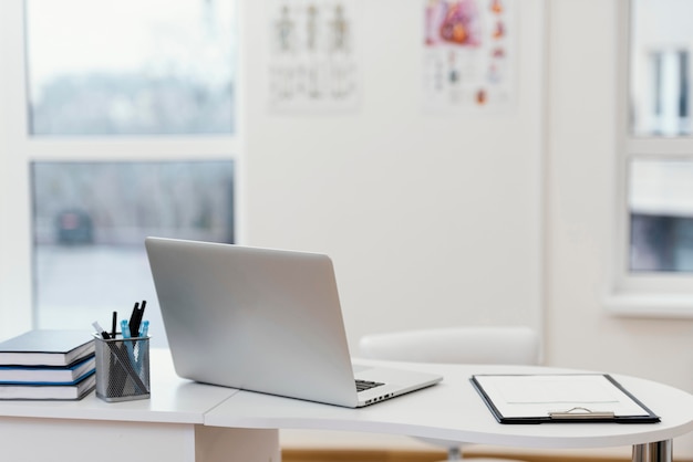 Free photo desk arrangement with laptop