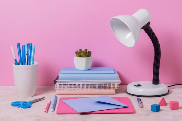 Desk arrangement with pink and blue items