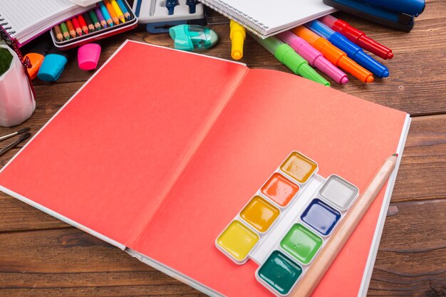 Desk cluttered with office supplies