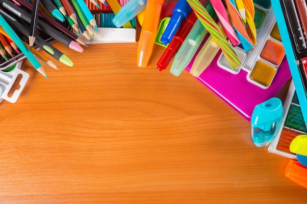 Desk cluttered with office supplies