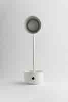 Free photo desk lamp with minimalist monochrome background