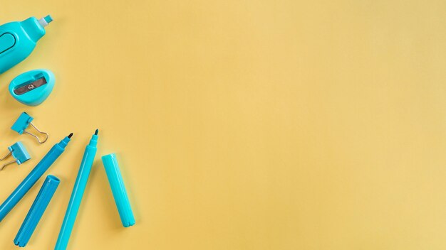 Desk and school supplies on light background